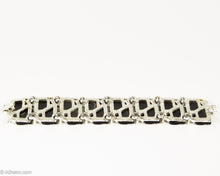Load image into Gallery viewer, VINTAGE BLACK THERMOSET LUCITE WITH BEIGE ENAMEL LEAVES SILVER TONE LINKS BRACELET/ 1950s