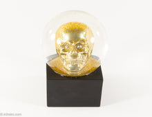 Load image into Gallery viewer, GLITTER/ BLING GOLD SKULL SNOWGLOBE ON BLACK WOOD BASE HALLOWEEN

