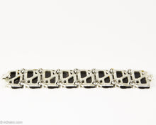 Load image into Gallery viewer, VINTAGE BLACK THERMOSET LUCITE WITH BEIGE ENAMEL LEAVES SILVER TONE LINKS BRACELET/ 1950s
