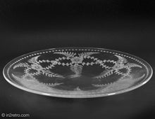 Load image into Gallery viewer, ROUND CLEAR GLASS PLATE WITH ETCHED FLOWERS AND LEAVES WITH DOTTED RIM DETAIL

