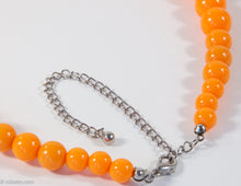 Load image into Gallery viewer, VINTAGE ORANGE PLASTIC GRADUATED BEADS NECKLACE/ NEW OLD STOCK
