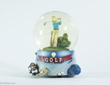 Load image into Gallery viewer, MUSICAL GOLF GLASS SNOW GLOBE OF LADY GOLFER WATER FILLED COLORFUL SPARKLES PLAYS &#39;TOP OF THE WORLD&#39;
