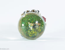 Load image into Gallery viewer, MUSICAL GOLF GLASS SNOW GLOBE OF LADY GOLFER WATER FILLED COLORFUL SPARKLES PLAYS &#39;TOP OF THE WORLD&#39;
