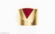 Load image into Gallery viewer, VINTAGE SIGNED MONET MATTE GOLD TONE WIDE 3D CUFF BRACELET WITH LARGE TRIANGULAR DEEP RED STONE
