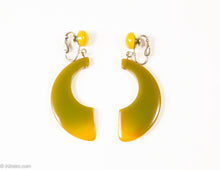 Load image into Gallery viewer, VINTAGE BAKELITE OLIVE AND BUTTERSCOTCH HALF-MOON/CRESCENT DANGLE CLIP EARRINGS/ 1960s-1970s
